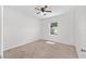Bright bedroom with carpeted floors and window view at 7054 Sw 64Th Ter, Ocala, FL 34476