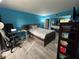 Bright bedroom with hard surface flooring, large mirrored closet doors and blue painted walls at 8134 Fairways Cir # R203, Ocala, FL 34472