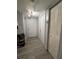 Bright foyer with wood-look flooring, closet and white door adds to the home's appeal at 8134 Fairways Cir # R203, Ocala, FL 34472