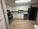 Well-appointed kitchen with stainless steel appliances, white cabinets, and ample counter space for meal preparation at 8134 Fairways Cir # R203, Ocala, FL 34472