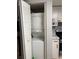 A laundry closet with stackable washer and dryer provides convenience in a compact space at 8134 Fairways Cir # R203, Ocala, FL 34472