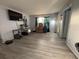 Well-lit living room boasting stylish flooring, creating an ideal space for entertaining and everyday living at 8134 Fairways Cir # R203, Ocala, FL 34472