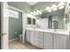 Well-lit bathroom with double vanity, ample storage, a large mirror, and convenient access to toilet and shower at 8380 Sw 82Nd Cir, Ocala, FL 34481