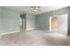 Expansive bedroom with natural light, a ceiling fan, and doorways leading to other rooms and a bathroom at 8380 Sw 82Nd Cir, Ocala, FL 34481