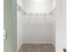 An empty walk-in closet with wire shelving for storage and carpeting at 8380 Sw 82Nd Cir, Ocala, FL 34481