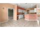 Open concept kitchen with white cabinets, neutral countertops, and a breakfast bar at 8380 Sw 82Nd Cir, Ocala, FL 34481