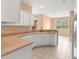 Spacious kitchen featuring lots of cabinets, countertops, tile flooring, and modern appliances at 8380 Sw 82Nd Cir, Ocala, FL 34481