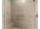 A tile shower with a built-in bench and a handheld shower head attachment at 8380 Sw 82Nd Cir, Ocala, FL 34481