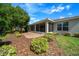 Well-maintained backyard with mature landscaping and a screened-in lanai attached to the home at 8640 Sw 83Rd Loop, Ocala, FL 34481