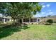 Lush backyard with a screened lanai, providing a private outdoor retreat at 8640 Sw 83Rd Loop, Ocala, FL 34481