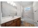 Bathroom showcasing a vanity, toilet, and bathtub with shower at 8640 Sw 83Rd Loop, Ocala, FL 34481