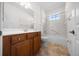 Bathroom showcasing a vanity, toilet, and bathtub with tile surround at 8640 Sw 83Rd Loop, Ocala, FL 34481