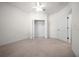 Bedroom featuring a ceiling fan and closet at 8640 Sw 83Rd Loop, Ocala, FL 34481