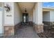 Elegant covered entrance with stone accents and a well-lit porch at 8640 Sw 83Rd Loop, Ocala, FL 34481