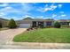 Inviting single-story home with manicured lawn, fresh landscaping, and brick paved driveway at 8640 Sw 83Rd Loop, Ocala, FL 34481