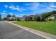 Charming single-story home featuring a well-manicured lawn, lush landscaping, and a welcoming entrance at 8640 Sw 83Rd Loop, Ocala, FL 34481