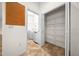 Hallway view of the laundry room with shelving and a closet with multiple shelves at 8640 Sw 83Rd Loop, Ocala, FL 34481