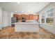 Bright kitchen with stainless appliances, tile floors, and a central island, perfect for entertaining at 8640 Sw 83Rd Loop, Ocala, FL 34481