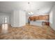 Bright living area flowing into a kitchen with stainless appliances and an island at 8640 Sw 83Rd Loop, Ocala, FL 34481