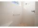 Tiled shower with a built-in seat and chrome fixtures at 8640 Sw 83Rd Loop, Ocala, FL 34481