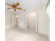 Bedroom with a ceiling fan and walk-in closet at 8704 Sw 94Th Ln # G, Ocala, FL 34481