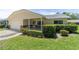 Well-maintained home featuring manicured landscaping, a covered porch, and an attached garage at 8704 Sw 94Th Ln # G, Ocala, FL 34481