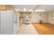 White appliances and wood cabinets in this bright open kitchen at 8704 Sw 94Th Ln # G, Ocala, FL 34481