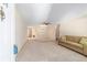 Spacious living area with neutral carpet, ceiling fan, and open access to other rooms at 8704 Sw 94Th Ln # G, Ocala, FL 34481