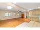 Bright kitchen and living room area with wood flooring and skylights at 8704 Sw 94Th Ln # G, Ocala, FL 34481