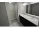 Modern bathroom featuring double vanity with tile flooring and a walk-in shower at 8795 Juniper Rd, Ocala, FL 34480