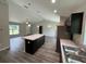 Bright, open kitchen with stainless steel appliances, a center island, and modern countertops at 8795 Juniper Rd, Ocala, FL 34480