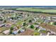 Aerial view of the neighborhood showcasing single Gathering homes and verdant landscape in central Florida at 9641 Se 70Th Ter, Ocala, FL 34472