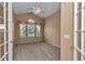 Bedroom features neutral paint and carpet flooring with natural light from a large window at 9641 Se 70Th Ter, Ocala, FL 34472