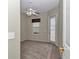 Bedroom with neutral paint, carpet flooring, and door to back yard at 9641 Se 70Th Ter, Ocala, FL 34472