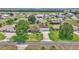 Beautiful exterior view showcasing the home's mature landscaping, long driveway, and well-manicured lawn at 9641 Se 70Th Ter, Ocala, FL 34472