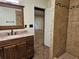 Bathroom featuring a tiled shower with updated vanity at 9805 Se 182Nd Avenue Rd, Ocklawaha, FL 32179