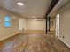 Open living area featuring modern flooring and unique spiral staircase at 9805 Se 182Nd Avenue Rd, Ocklawaha, FL 32179