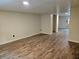 Bright living room with wood-look floors and neutral paint, creating a warm and inviting atmosphere at 9805 Se 182Nd Avenue Rd, Ocklawaha, FL 32179