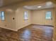 Bright living room with wood-look flooring and natural light at 9805 Se 182Nd Avenue Rd, Ocklawaha, FL 32179