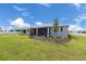 View of the backyard and exterior of the home at 10008 Sw 85Th Place Rd, Ocala, FL 34481