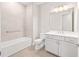 Bright bathroom with shower, tub, toilet, and vanity with plenty of storage at 10008 Sw 85Th Place Rd, Ocala, FL 34481
