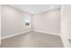 Bedroom featuring a large window and wood-style tile flooring at 10008 Sw 85Th Place Rd, Ocala, FL 34481