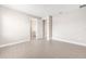 Bright bedroom featuring wood-style tile floors, neutral walls, and white trim at 10008 Sw 85Th Place Rd, Ocala, FL 34481