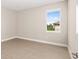 Bedroom with tile floors, window, and baseboard trim at 10008 Sw 85Th Place Rd, Ocala, FL 34481
