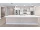 Stylish kitchen showcasing a spacious island, modern appliances, and sleek, white cabinetry at 10008 Sw 85Th Place Rd, Ocala, FL 34481