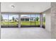 Covered lanai with screened windows overlooking the backyard at 10008 Sw 85Th Place Rd, Ocala, FL 34481