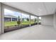 Screened lanai overlooking a landscaped backyard at 10008 Sw 85Th Place Rd, Ocala, FL 34481
