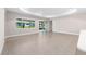 Spacious living room with large windows and sliding glass doors, offering plenty of natural light at 10008 Sw 85Th Place Rd, Ocala, FL 34481