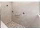 Shower with pebble floor, seat, niche and shower head at 10008 Sw 85Th Place Rd, Ocala, FL 34481