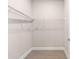 Walk-in closet equipped with shelving for ample storage and organization at 10008 Sw 85Th Place Rd, Ocala, FL 34481